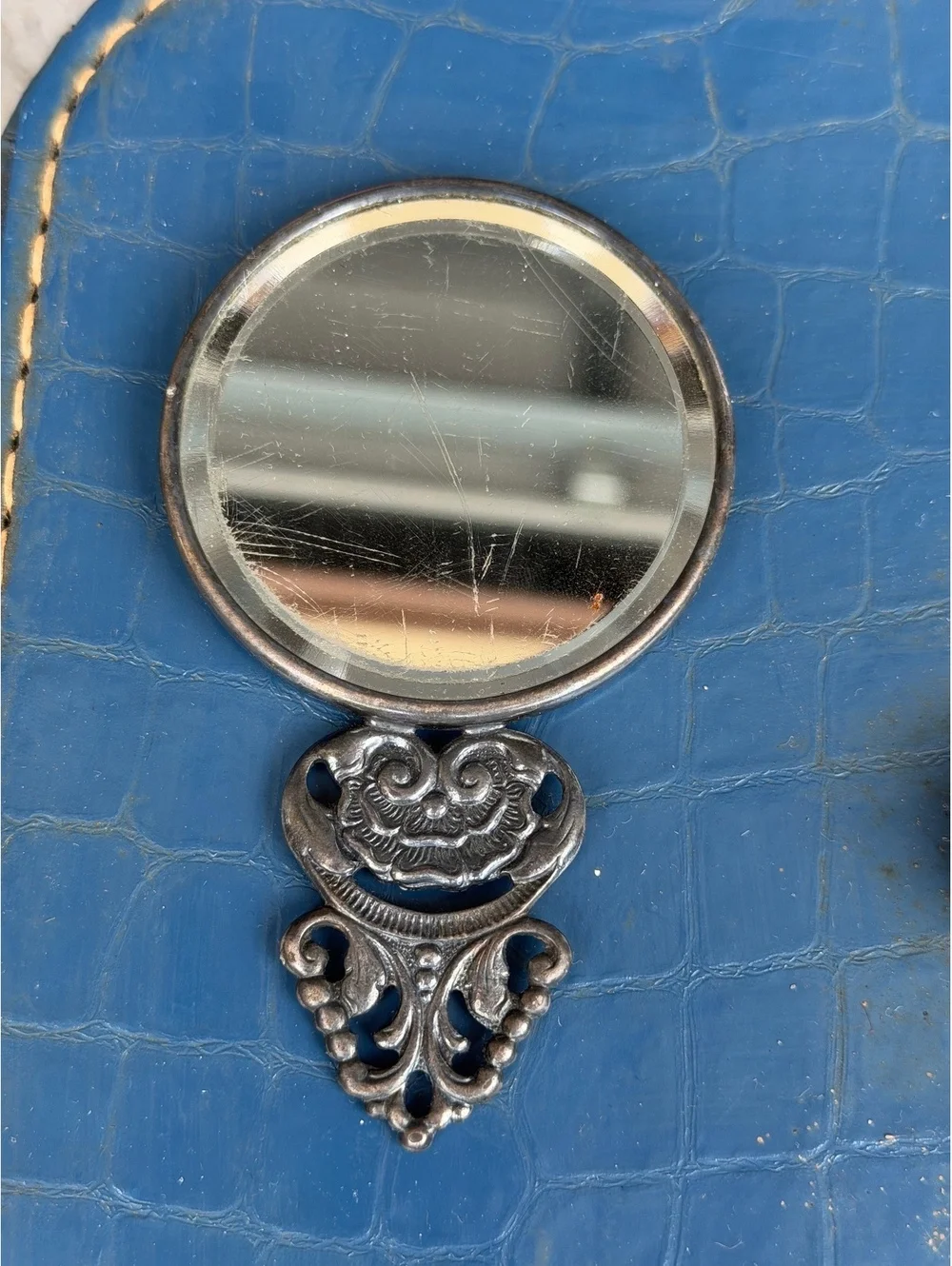 Vintage Decorative Hand Mirror with Engraved Scene and Ornate Handle